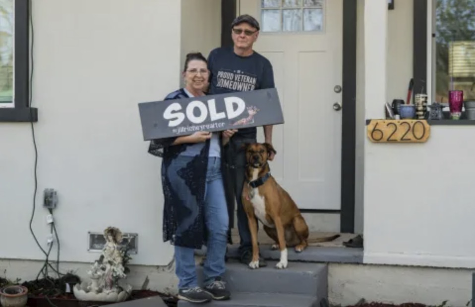 picture of Mark S. in front of a house