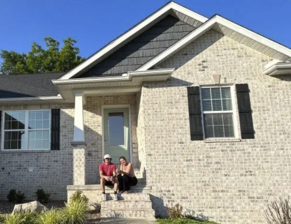 picture of Britini M. in front of a house