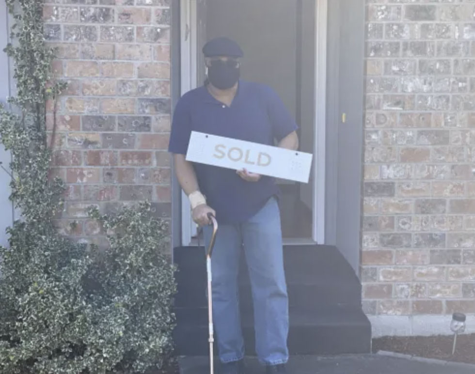 picture of Kenneth G. in front of a house